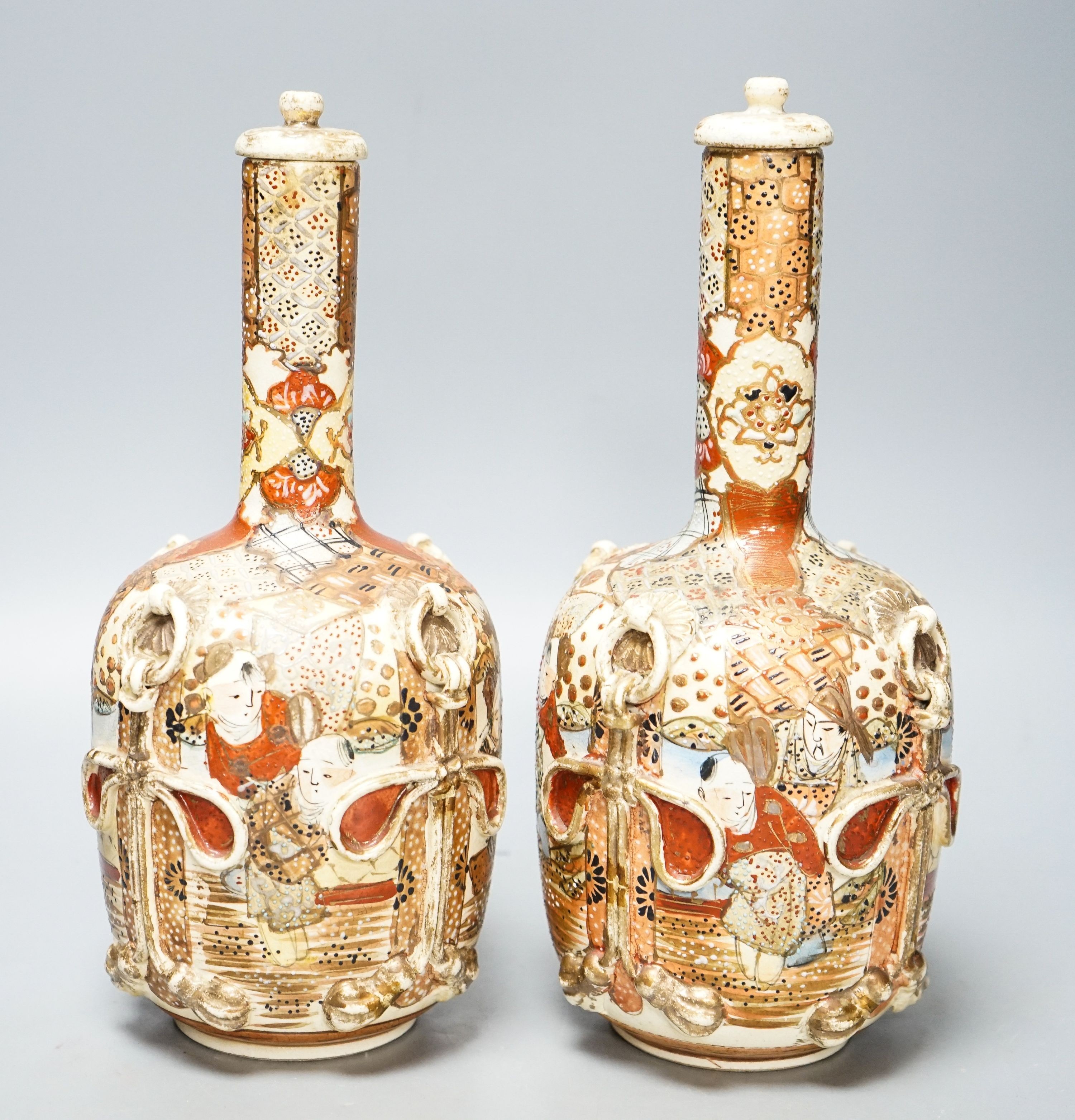 A pair of Japanese Satsuma pottery lidded bottle vases 27cm